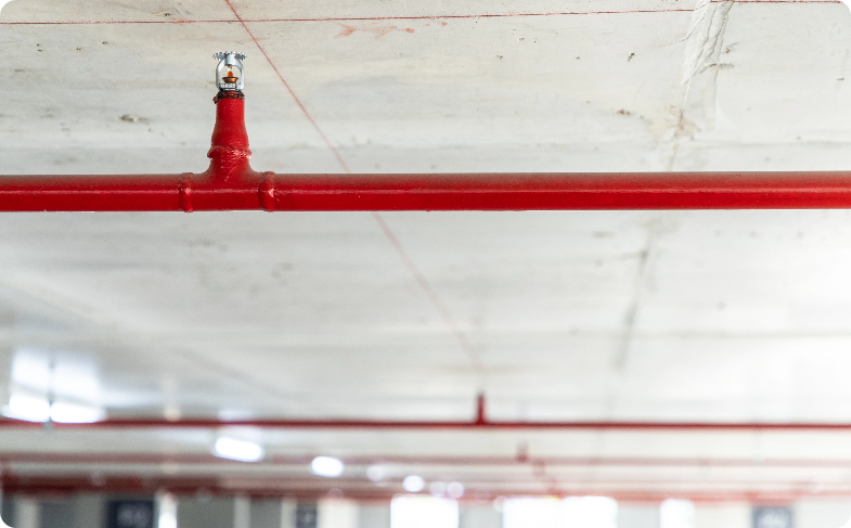 Pre-action wet piper fire sprinkler silver nozzle head on a red pipe