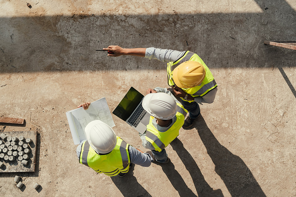 Engineers read fire safety articles on a construction site